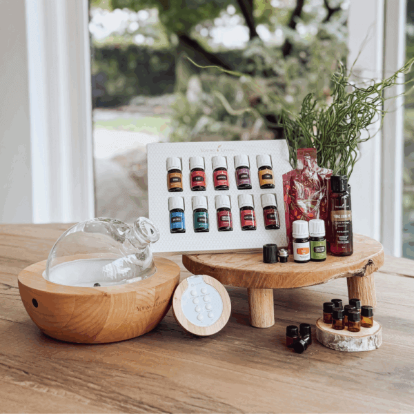 Starterkit met Aria Diffuser van Young Living – luxe diffuser van glas en hout met 12 etherische oliën, draagolie en NingXia Red in natuurlijke setting